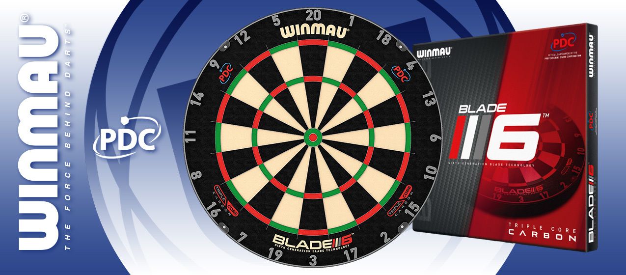Das Bild zeigt eine Winmau Dartschreibe Blade 6 zusammen mit ihrer Verpackung. Links ist das Logo von Winmau und das PDC-Emblem zu sehen.